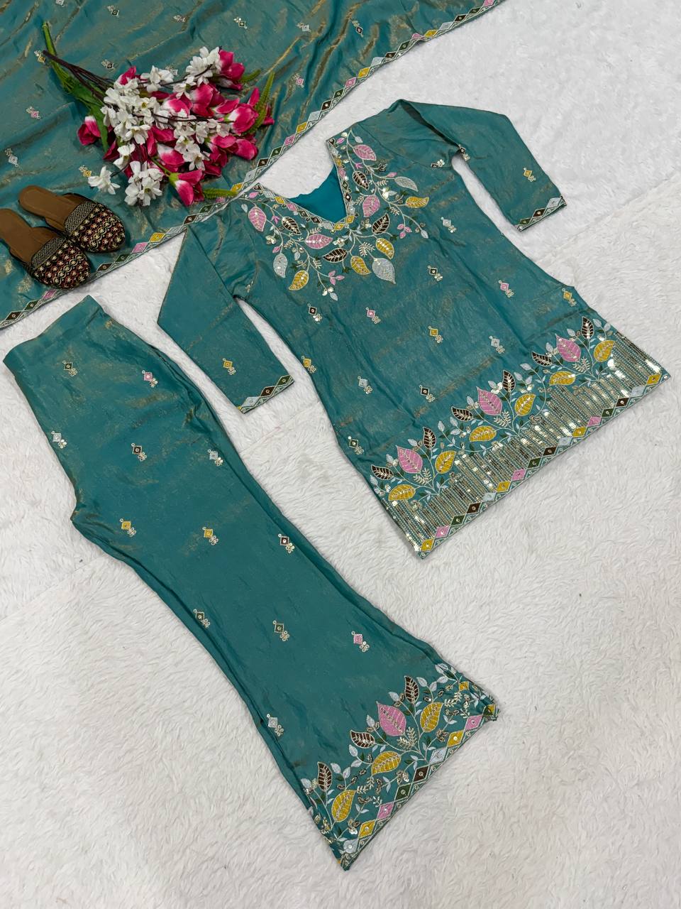 Elegant Rust Orange Silk Kurta and Flared Palazzo Set Adorned with Intricate Multicolored Botanical Embroidery and Mirror Work